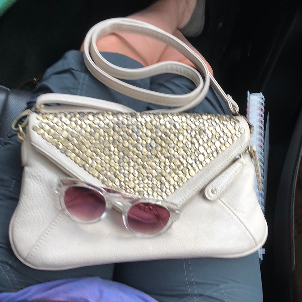 Kimchi Blue Ivory purse with bronze detailing.